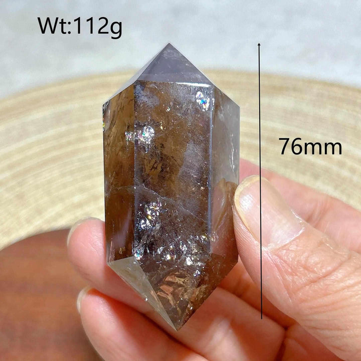 Smoky quartz double point crystal tower featuring natural rainbow inclusions, 76mm tall, perfect for energy meditation.