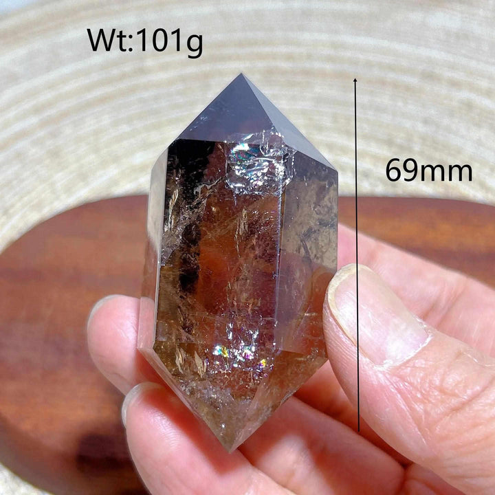 69mm smoky quartz double point crystal tower featuring natural rainbow flash inclusions for meditation and energy work.