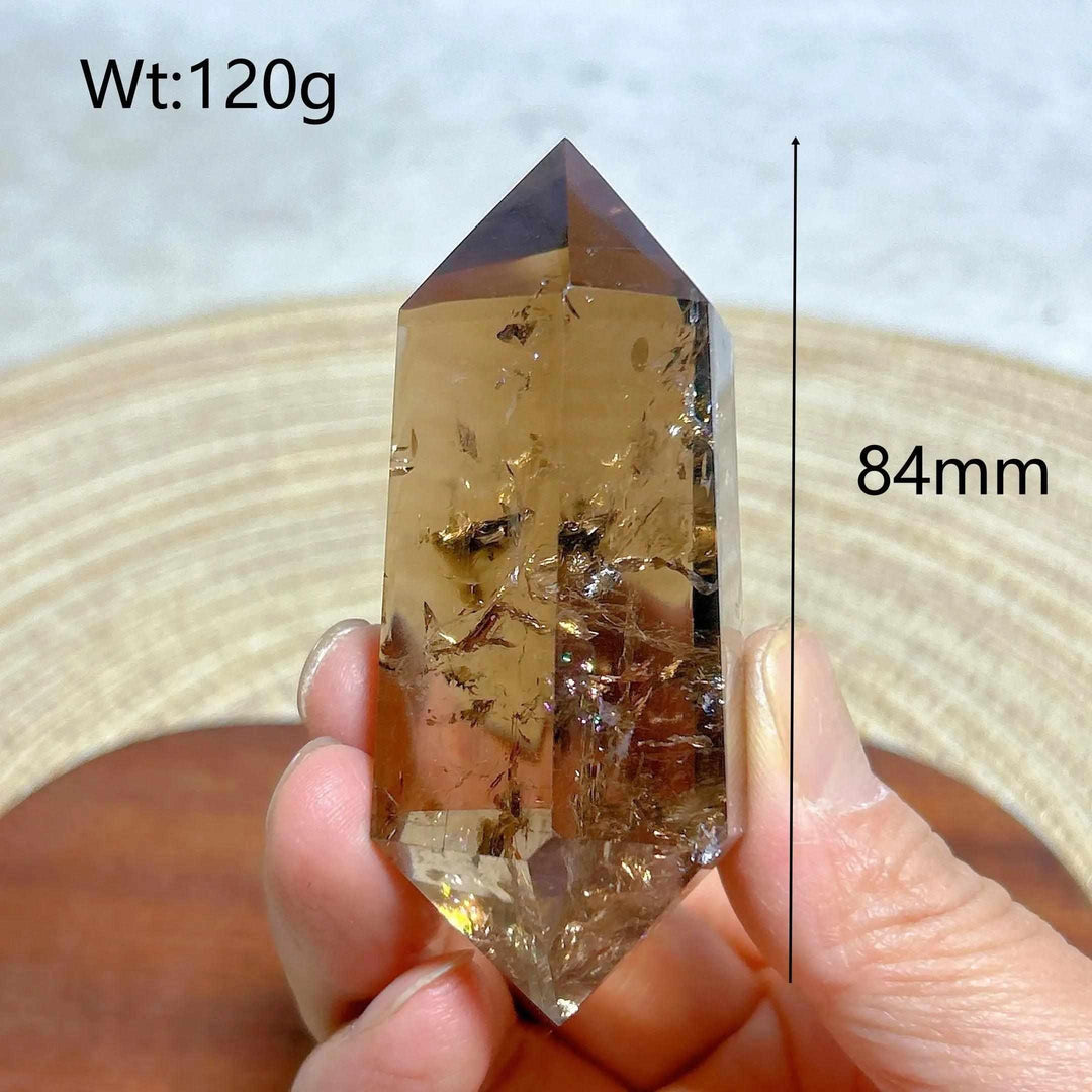 84mm smoky quartz double point crystal tower featuring natural rainbow inclusions for meditation and energy work.