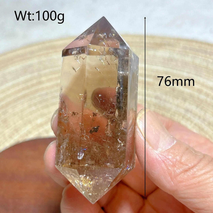 100g smoky quartz double point crystal tower with natural rainbow inclusions, 76mm tall for meditation and energy work.
