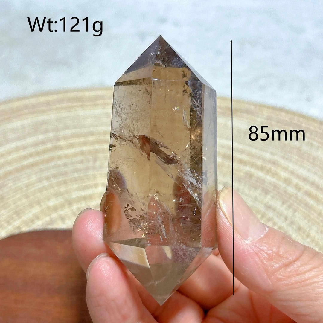 85mm smoky quartz double point crystal with natural rainbow inclusions, perfect for meditation and energy work.