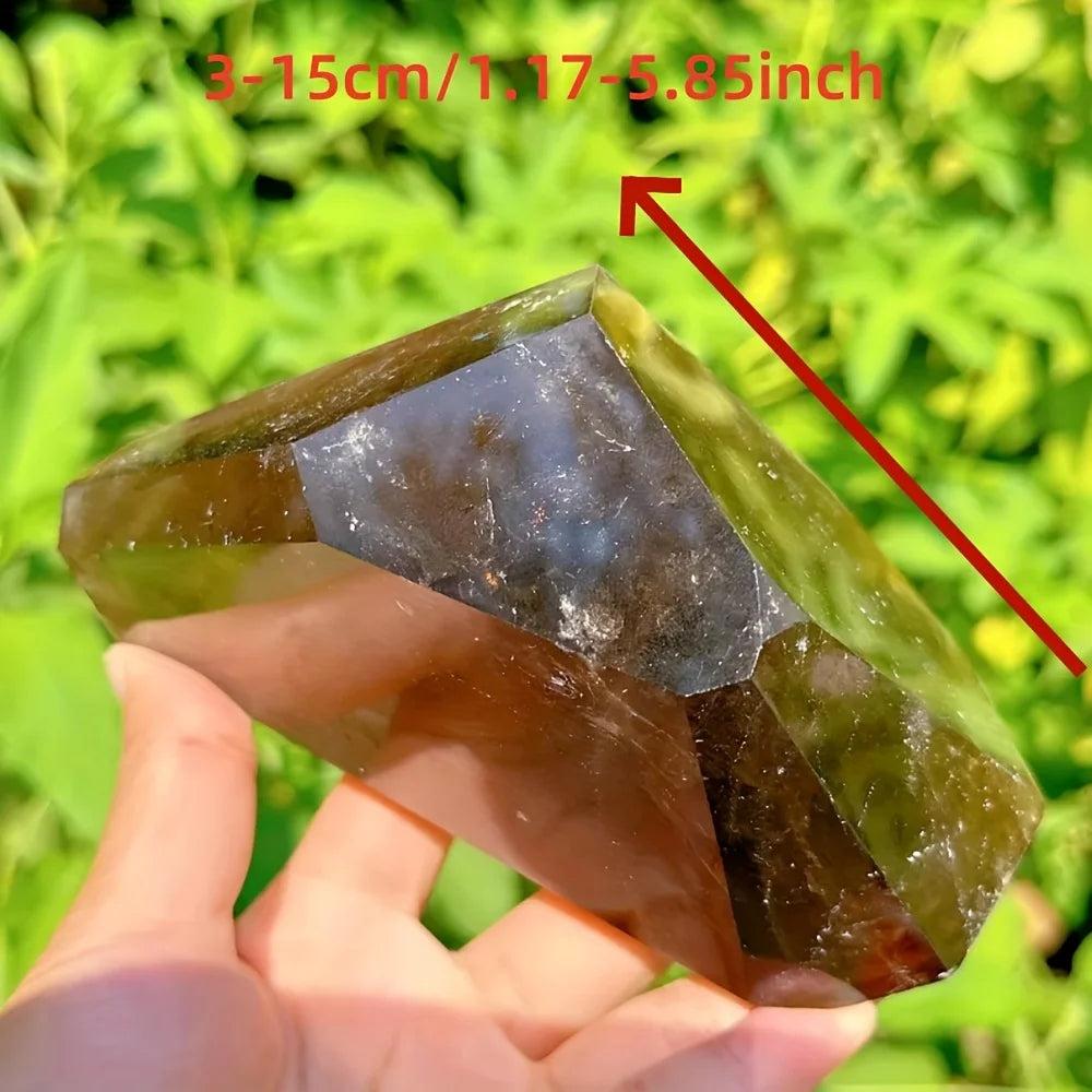Polished dark brown Smoky Quartz freeform crystal, held in hand, showing its grounding energy and natural contours.