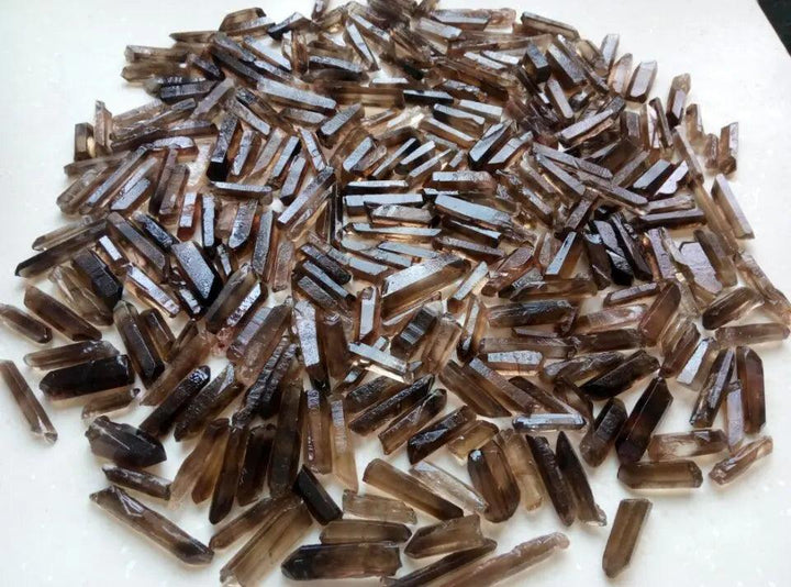 Bulk lot of natural Brazilian Smoky Quartz crystal points, raw terminated wands for grounding and healing.