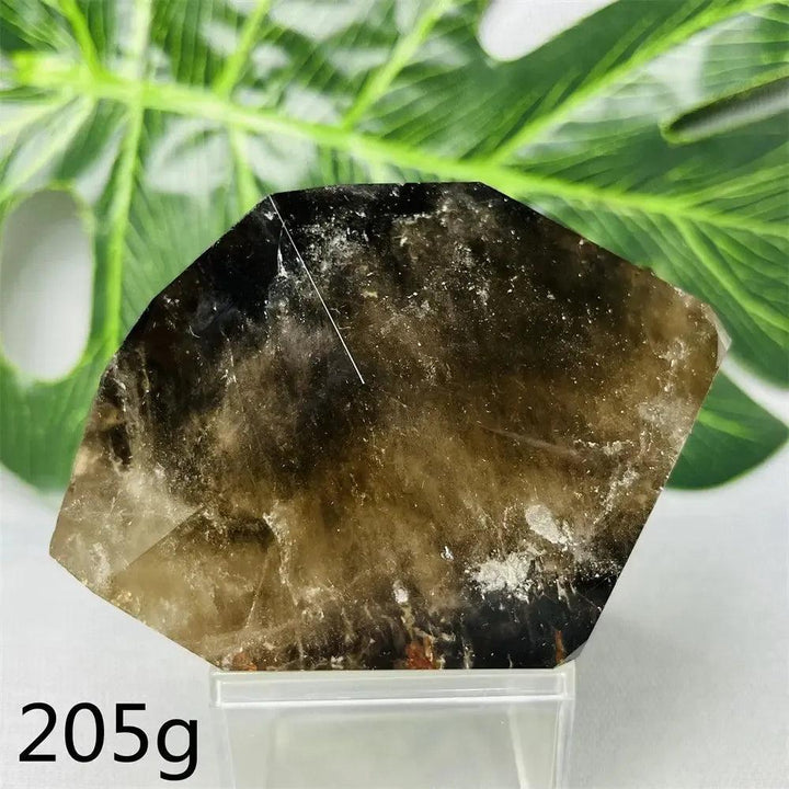 Hand-polished Smoky Quartz free-form crystal from Crystal Destiny, showing deep brown-to-charcoal tones and natural inclusions.