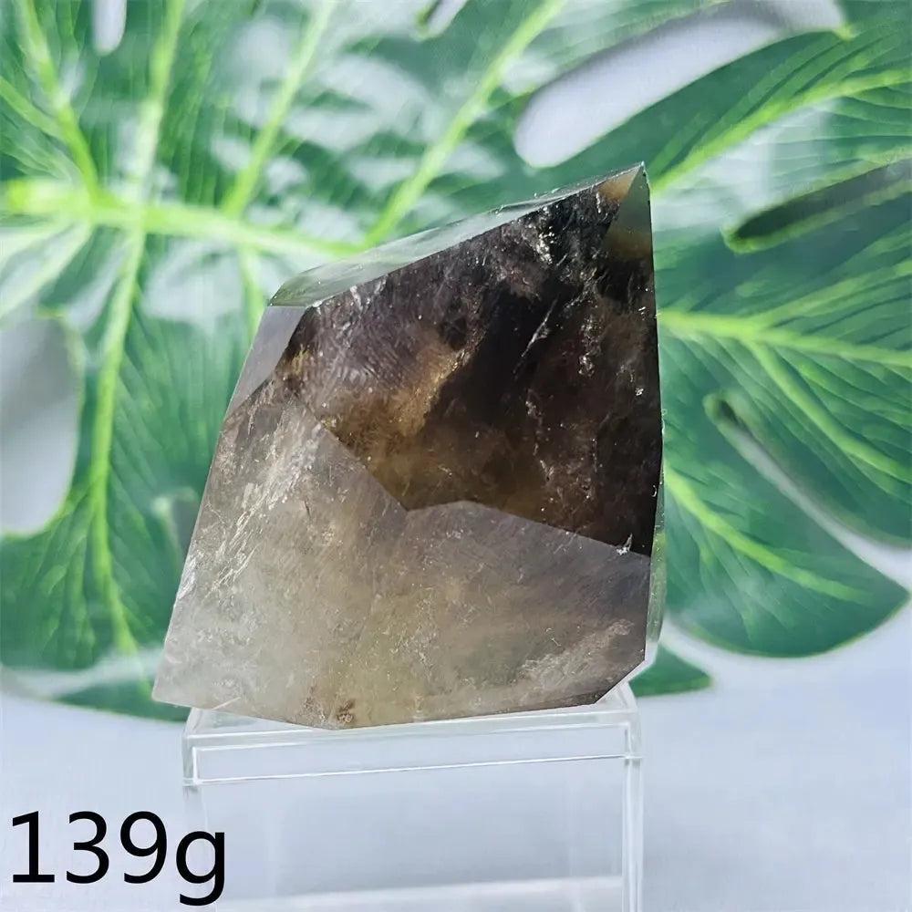 Hand-polished Smoky Quartz free-form crystal from Crystal Destiny, showcasing dark brown to charcoal hues.