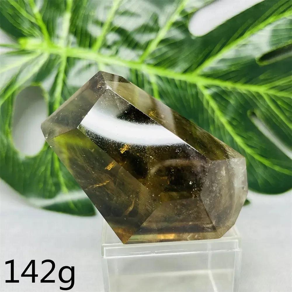 Hand-polished Smoky Quartz free-form crystal from Crystal Destiny, showing its deep brown-to-charcoal color and faceted sides.