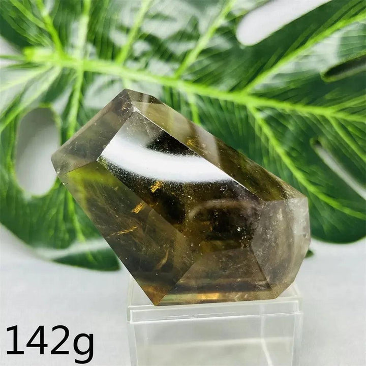 Hand-polished Smoky Quartz free-form crystal from Crystal Destiny, showing its deep brown-to-charcoal color and faceted sides.