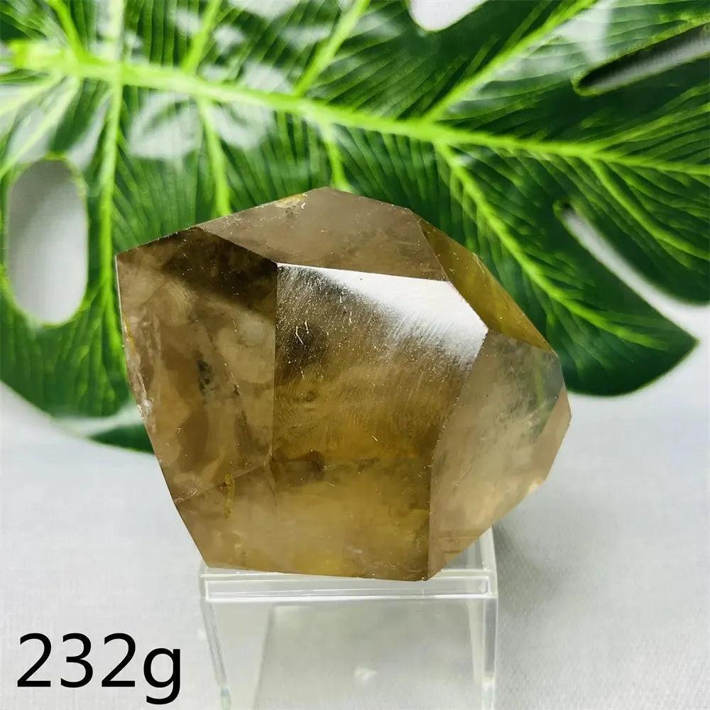 Hand-polished Smoky Quartz free-form crystal from Crystal Destiny, showcasing its deep brown-to-charcoal color and faceted shape.