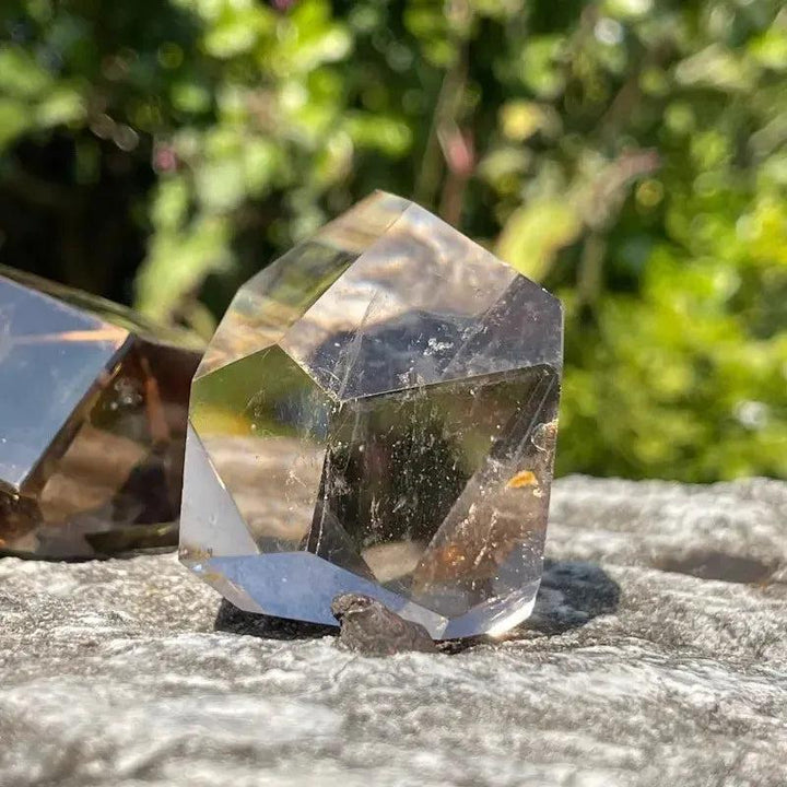 Polished smoky quartz freeform crystal from Crystal Destiny, showcasing its grounding energy and natural facets.