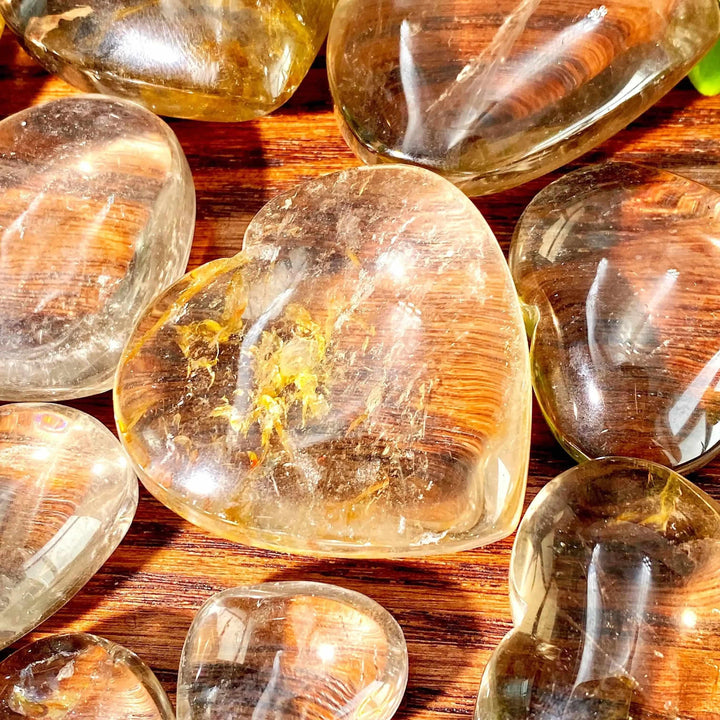 Polished smoky quartz heart with translucent brown and gray tones, perfect for grounding and Root Chakra healing.