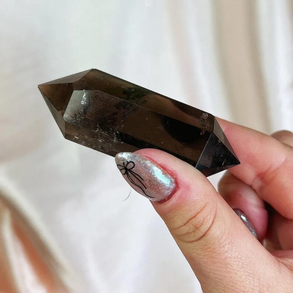 Deep translucent brown-grey Smoky Quartz raw crystal double termination specimen, 40-50mm, held by hand.