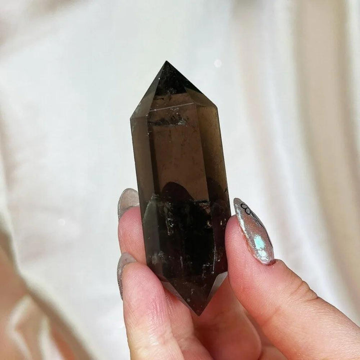 Deep translucent brown-grey Smoky Quartz raw crystal double termination specimen, 40-50mm, held for grounding energy.