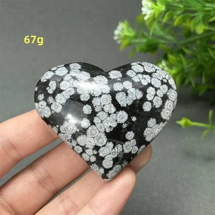 Polished Snowflake Obsidian Crystal Heart, black volcanic glass with white snowflake patterns, for grounding and healing.
