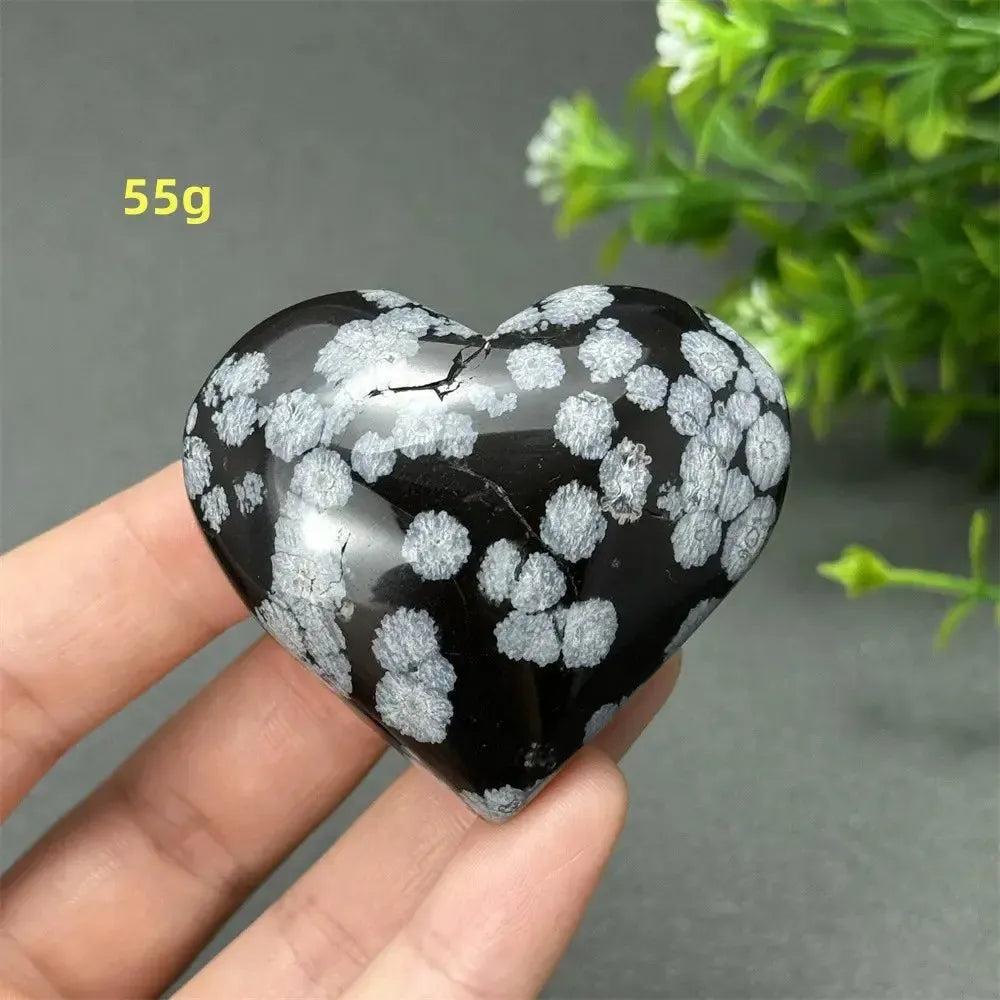 Polished Snowflake Obsidian Crystal Heart, 55g, showcasing black volcanic glass with white snowflake patterns.