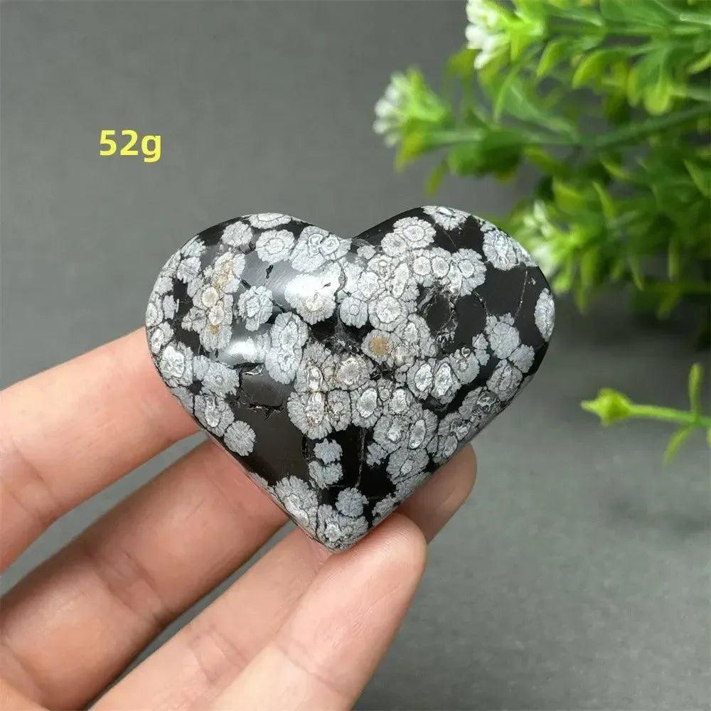 Polished Snowflake Obsidian crystal heart, 52g, displaying unique black volcanic glass with white snowflake patterns.