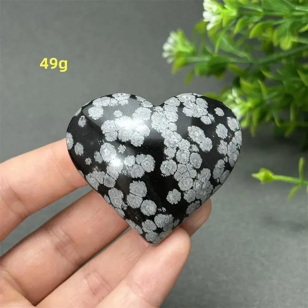 Polished Snowflake Obsidian Crystal Heart, 49g, showcasing black volcanic glass with white snowflake patterns.