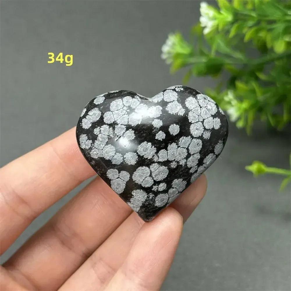 Polished Snowflake Obsidian Crystal Heart, 34g, showcasing black volcanic glass with white snowflake patterns.