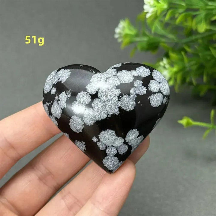 Polished Snowflake Obsidian Crystal Heart, 51g, showcasing black volcanic glass with white snowflake patterns.