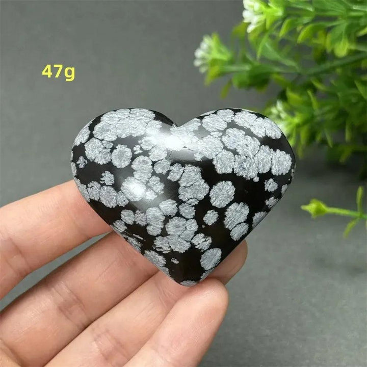 Polished Snowflake Obsidian Crystal Heart, 47g, showcasing black volcanic glass with white snowflake patterns.