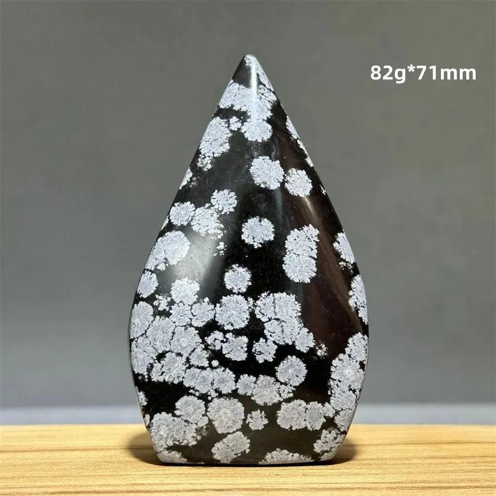 Snowflake Obsidian freeform torch from Crystal Destiny, 82g, 71mm. Black crystal with white snowflake patterns.