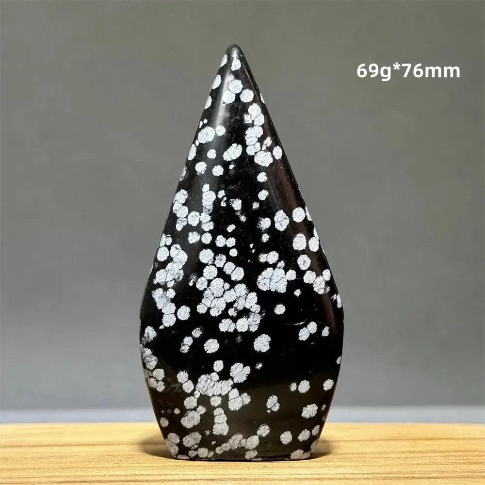 Snowflake Obsidian freeform torch from Crystal Destiny, a black crystal with white snowflake patterns.