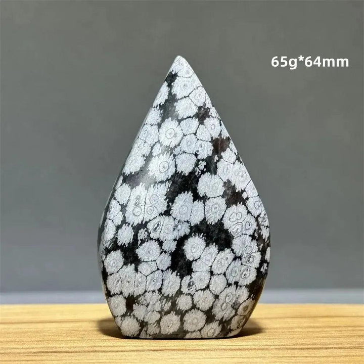 Snowflake Obsidian freeform torch from Crystal Destiny, 65g, 64mm. Black volcanic glass with white snowflake patterns.