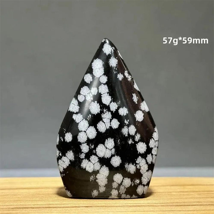 Snowflake Obsidian freeform torch from Crystal Destiny, featuring black volcanic glass with white snowflake-like patterns.