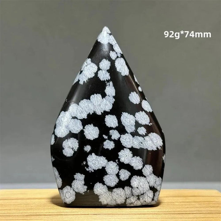 Snowflake Obsidian freeform torch from Crystal Destiny, featuring black volcanic glass with white "snowflake" patterns.
