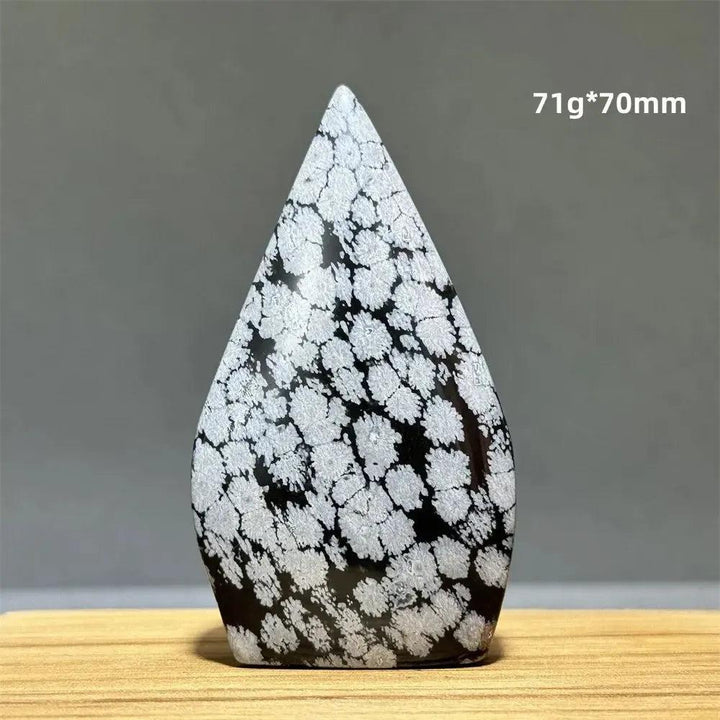 Snowflake Obsidian freeform torch from Crystal Destiny, featuring black volcanic glass with white snowflake patterns.