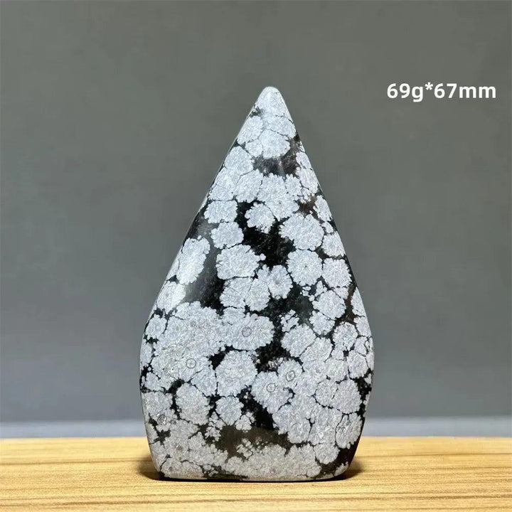 Snowflake Obsidian freeform torch from Crystal Destiny, featuring black volcanic glass with white snowflake patterns.