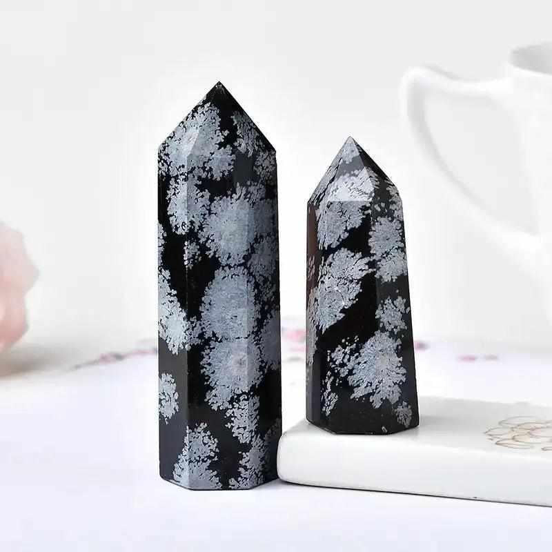Polished Snowflake Obsidian tower with black volcanic glass and white snowflake patterns for grounding and balance.