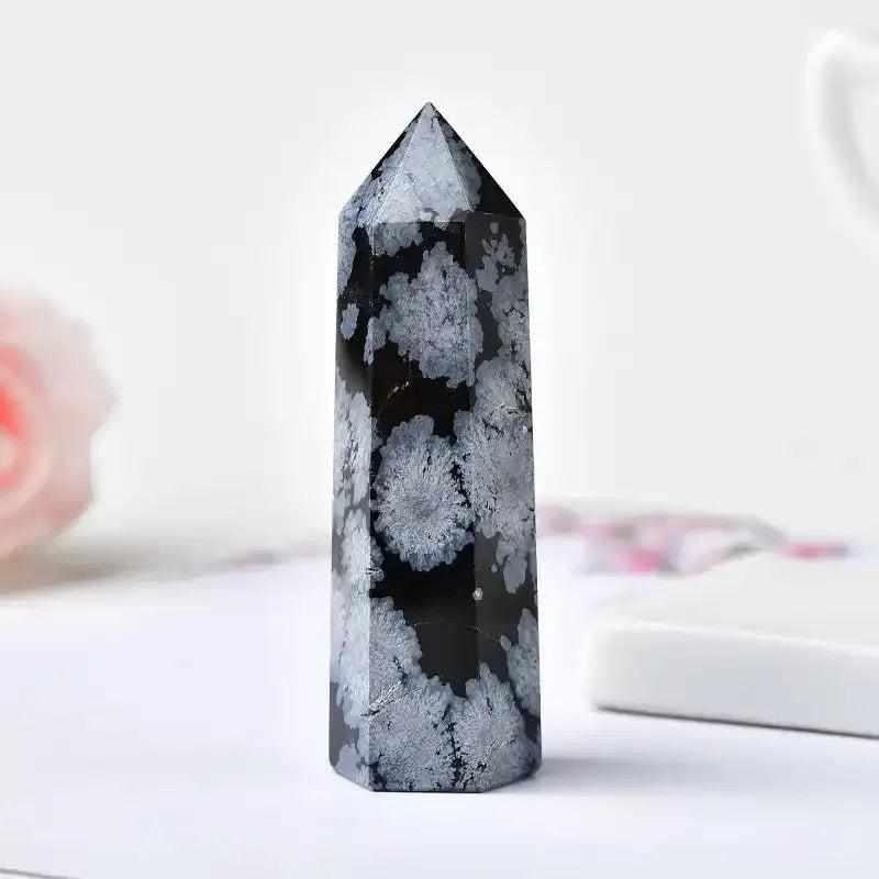 Polished Snowflake Obsidian tower with black volcanic glass and white snowflake patterns for grounding and clarity.