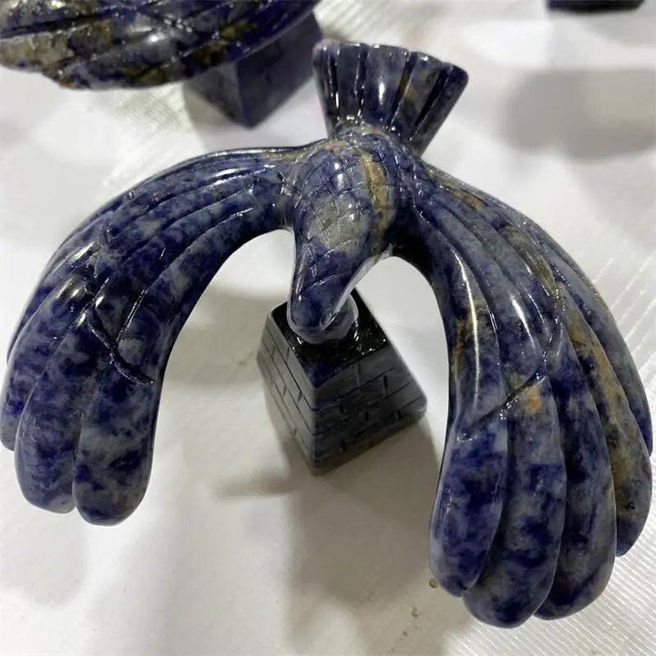 Deep blue Sodalite crystal eagle statue, hand-carved and balanced on a rotating pyramid base for focused energy.