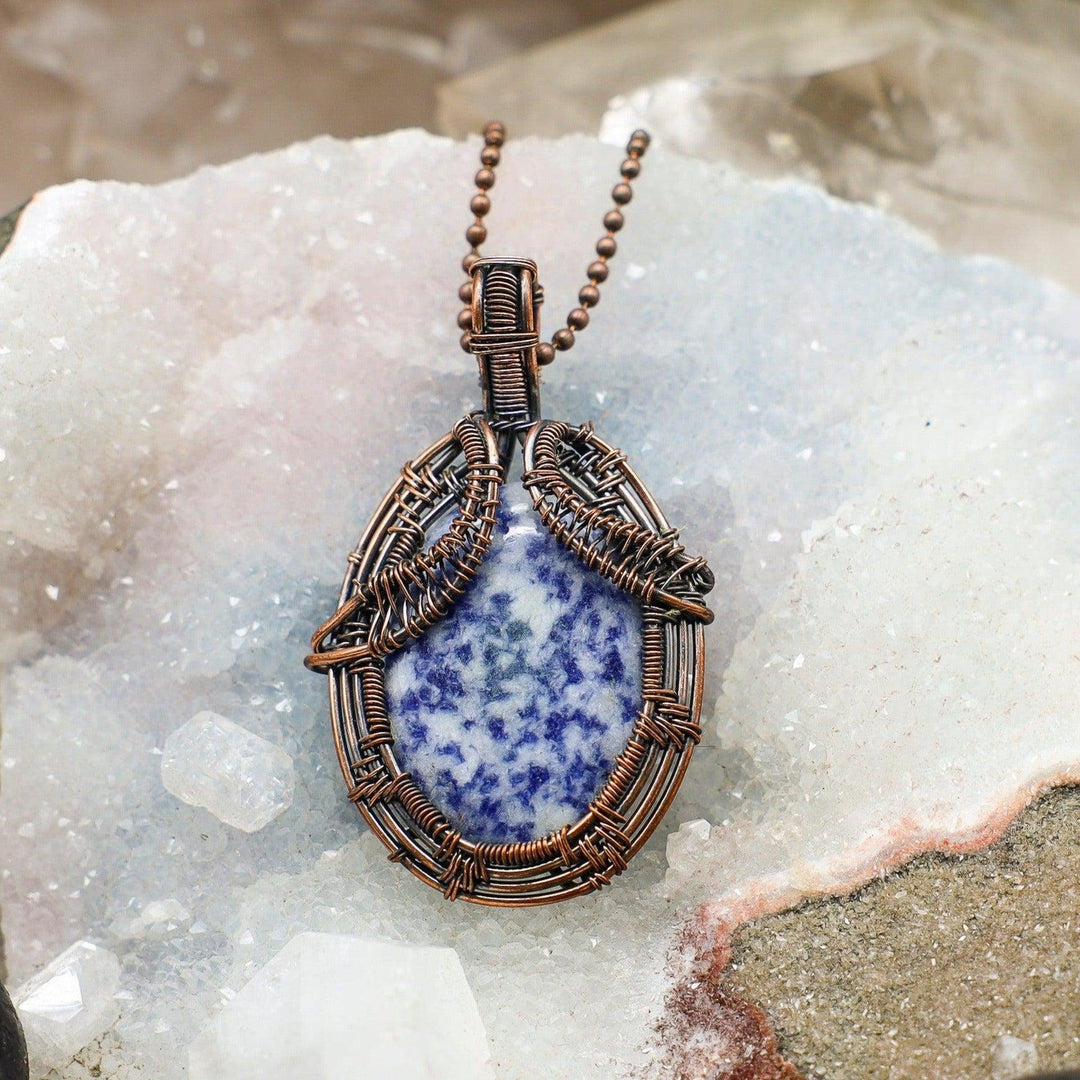 Sodalite Spotted Wire Wrap Pendant: 2.75" genuine blue Sodalite with white spots, wrapped in healing copper wire.