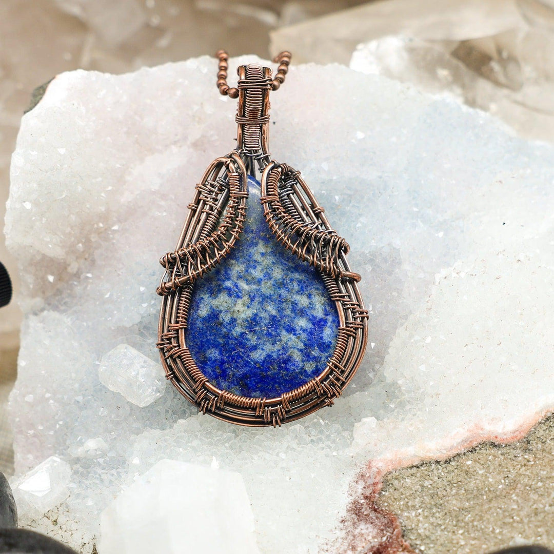 Sodalite Wire Wrap Crystal Pendant: Deep blue sodalite with white calcite veining, handcrafted in healing copper wire.