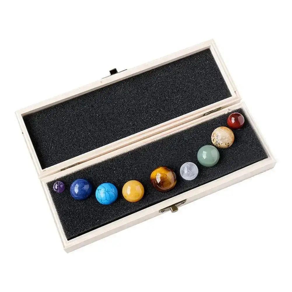 Solar System Nine Planets Crystal Set: Polished natural gemstone spheres in a wooden display box.