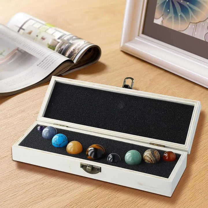 Solar System Nine Planets Crystal Set featuring colorful gemstone spheres in a wooden box for celestial energy and decor.