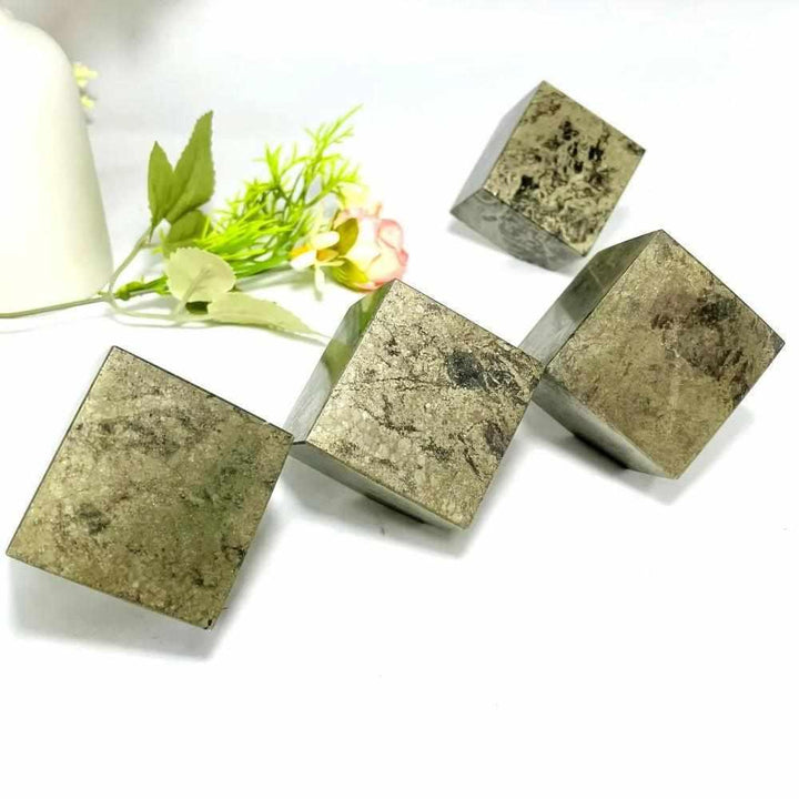 Natural pyrite leaning cubes with metallic gold luster, perfect for Solar Plexus chakra grounding and home decor.