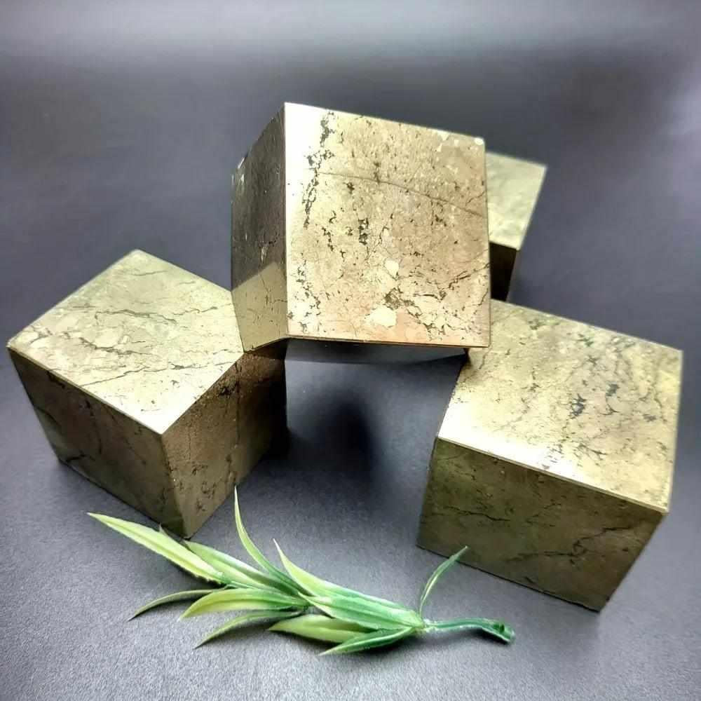Natural gold pyrite leaning cube specimen with reflective geometric faces, perfect for Solar Plexus chakra grounding.