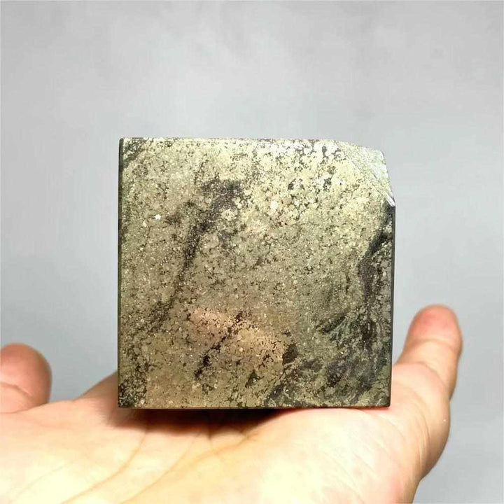 Sparkling Pyrite leaning cube specimen with reflective, geometric faces for Solar Plexus confidence and grounding energy.