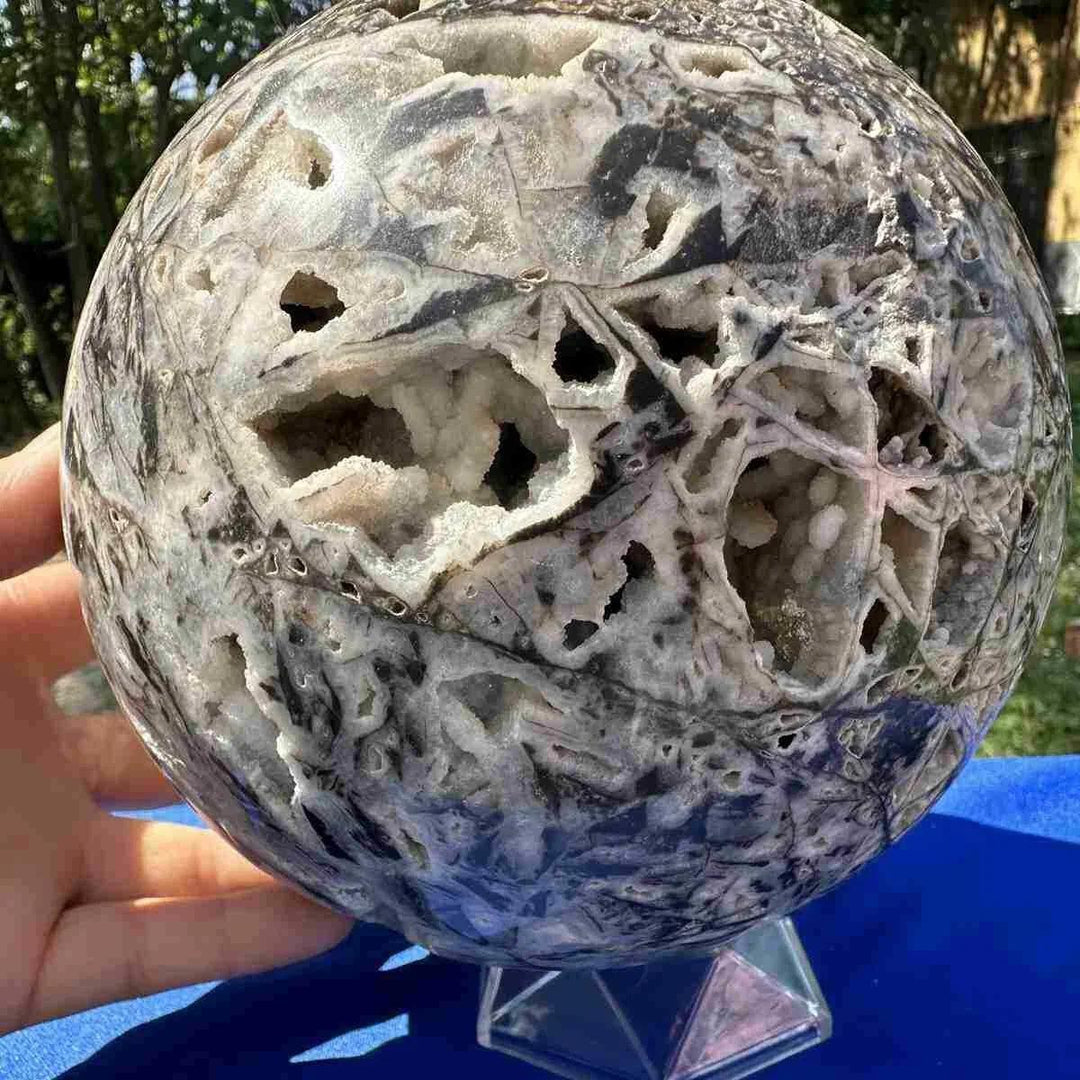 Sphalerite Crystal Sphere: Natural gray mineral ball with intricate white geode cavities, promoting grounding and vitality.