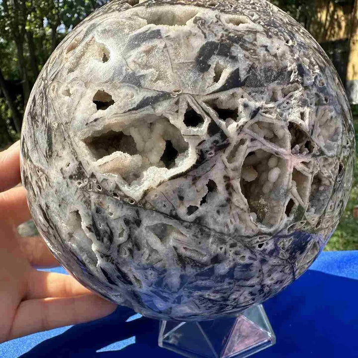 Sphalerite Crystal Sphere: Natural gray mineral ball with intricate white geode cavities, promoting grounding and vitality.
