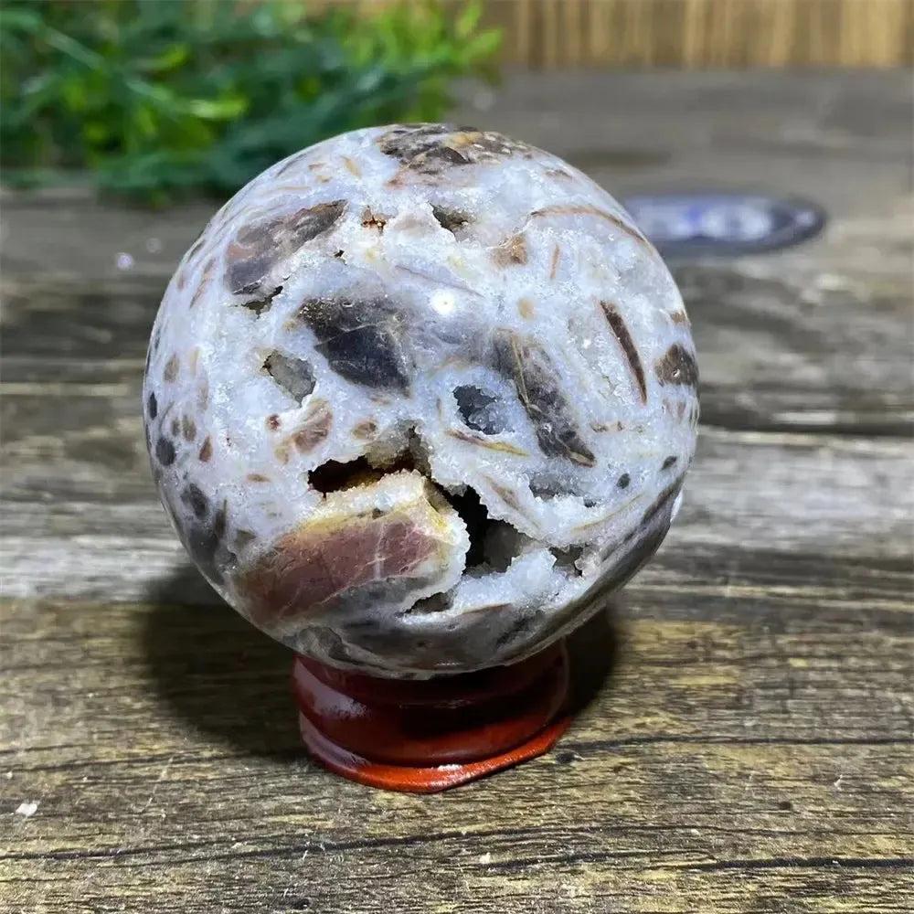 Sphalerite Sphere: Polished, earthy brown and white sphere with metallic luster, resinous appearance, and natural variations.