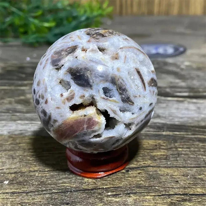 Sphalerite Sphere: Polished, earthy brown and white sphere with metallic luster, resinous appearance, and natural variations.
