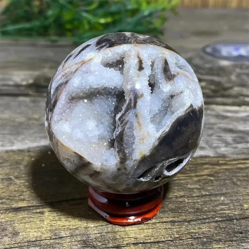 Sphalerite Sphere with Stand: Polished sphere with metallic luster, amber to dark brown tones, and sparkling white druzy.