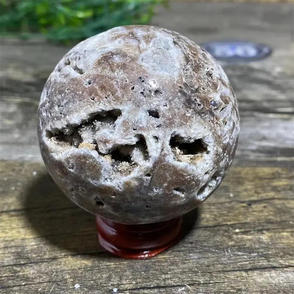 Polished Sphalerite Sphere with Stand: Earthy brown sphere with natural cavities, radiating grounding energy and vitality.