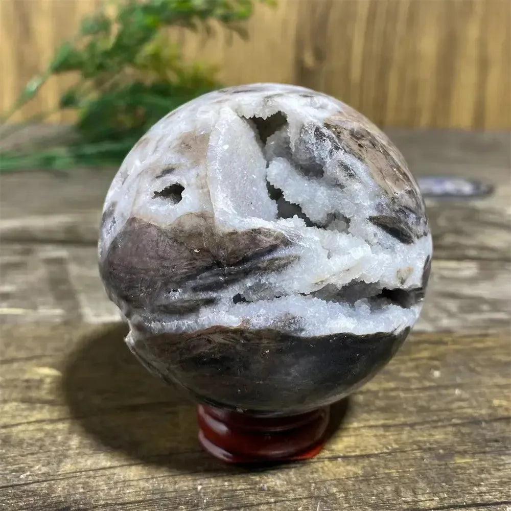 Sphalerite Sphere with Stand: Polished sphere showcasing metallic luster, rich amber to brown tones, and unique geode formations.