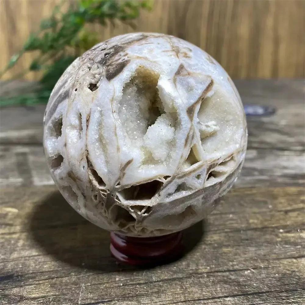 Sphalerite Sphere with Stand: Polished sphere with metallic luster, amber to brown tones, and brilliant flashes.