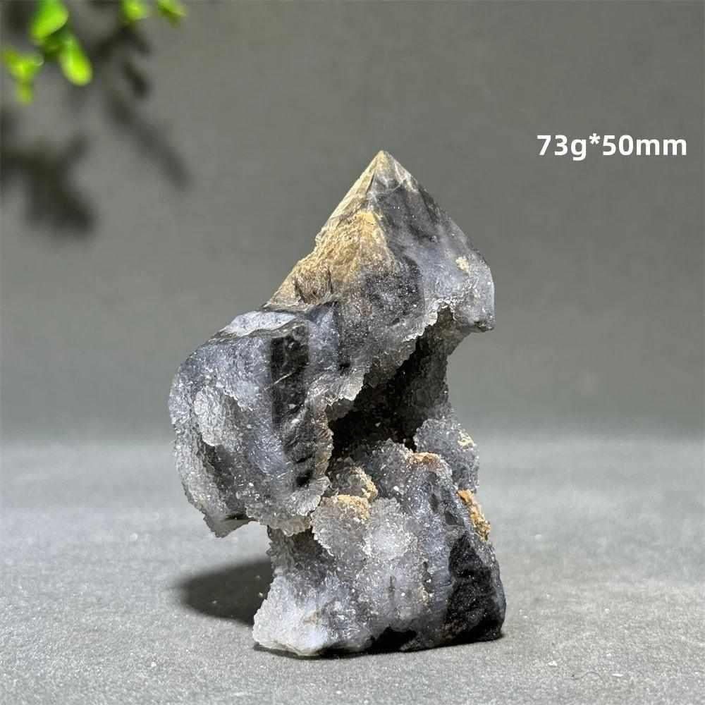 Polished Sphalerite in Quartz tower, a grounding 50mm crystal obelisk with earthy brown and black mineral inclusions.