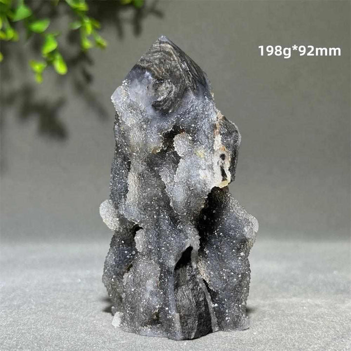 Polished Sphalerite in Quartz tower, 198g, 92mm. Dark grounding crystals in clear quartz for balance and vitality.